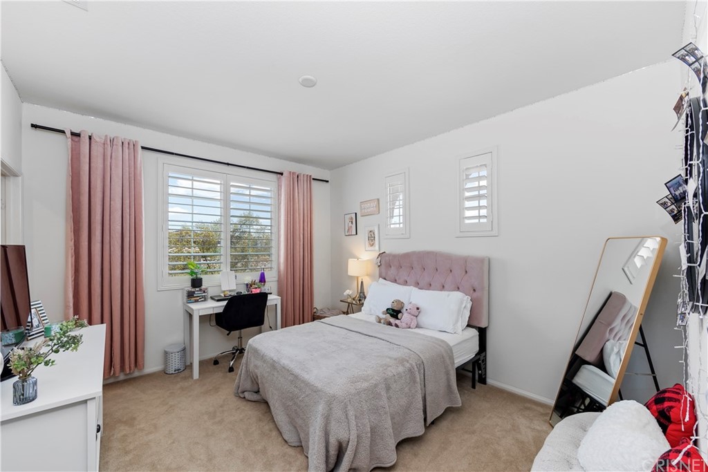 28504 Farrier Drive Valencia, CA 91354 - Photo 31 of 45 a bedroom with a bed and large windows