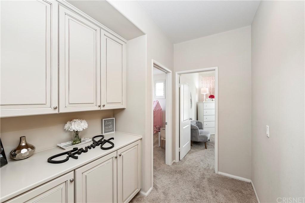 28504 Farrier Drive Valencia, CA 91354 - Photo 36 of 45 a kitchen with a sink and cabinets