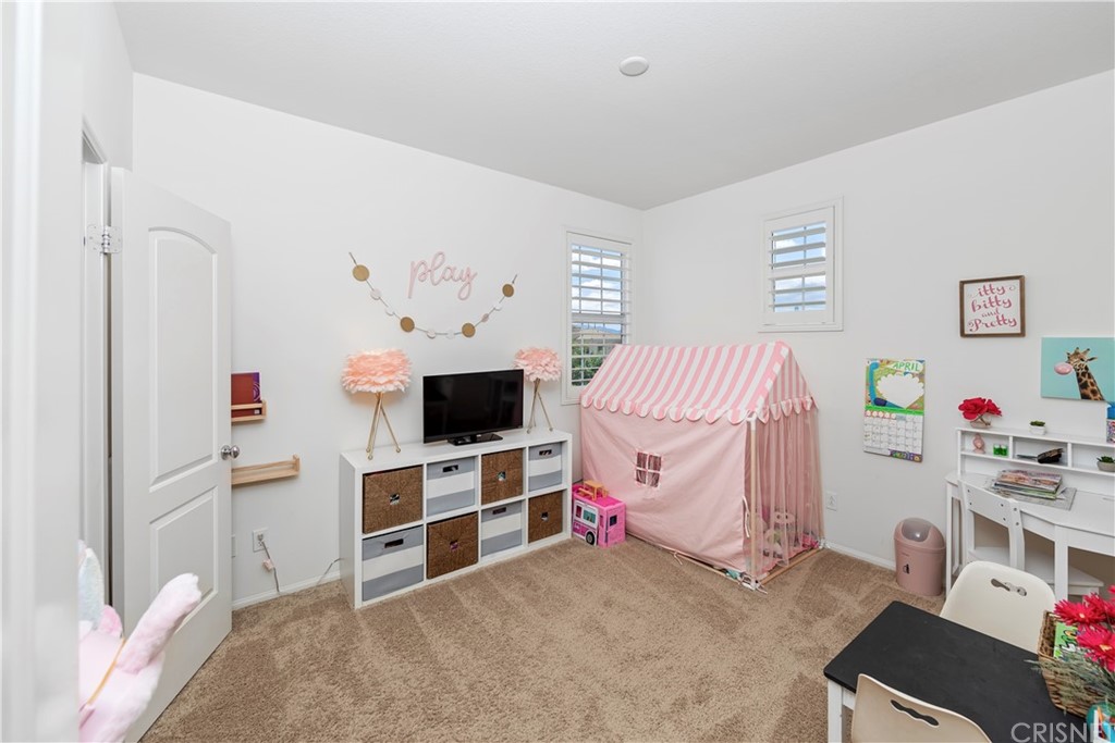 28504 Farrier Drive Valencia, CA 91354 - Photo 38 of 45 a bedroom with a bed and a flat screen tv