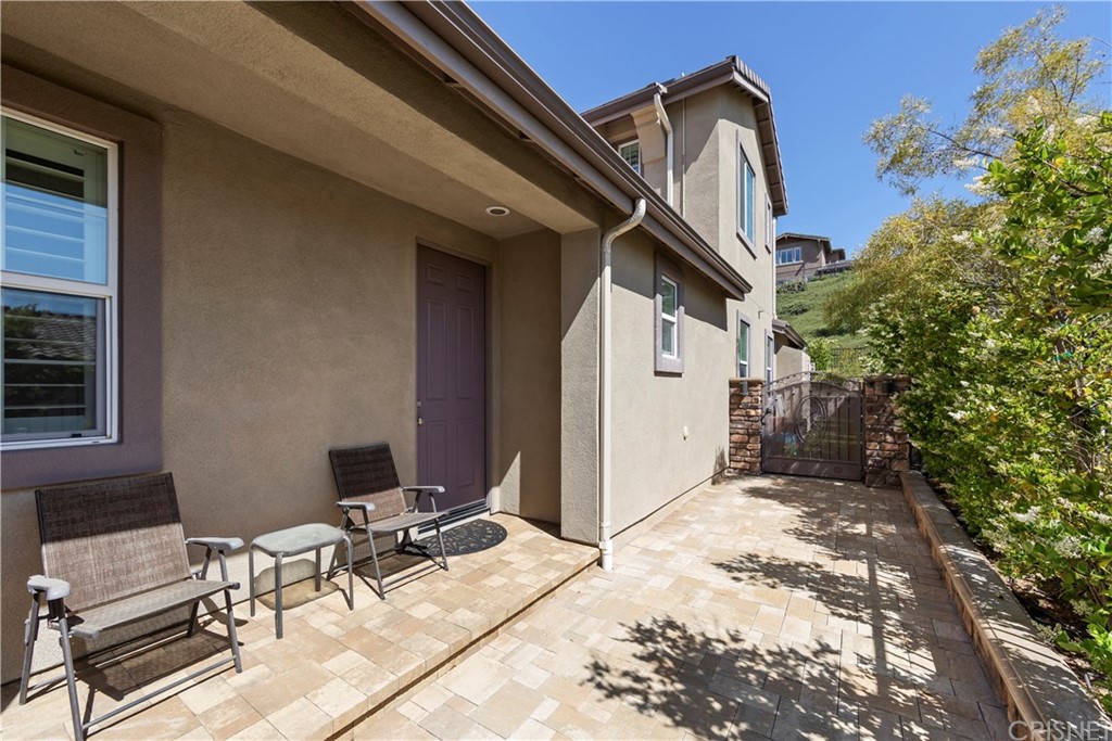 28504 Farrier Drive Valencia, CA 91354 - Photo 4 of 45 a view of backyard with a table and chairs and potted plants