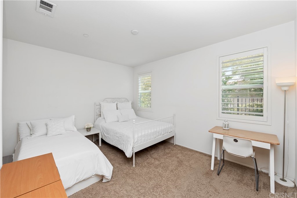 28504 Farrier Drive Valencia, CA 91354 - Photo 42 of 45 a bedroom with two beds and a window