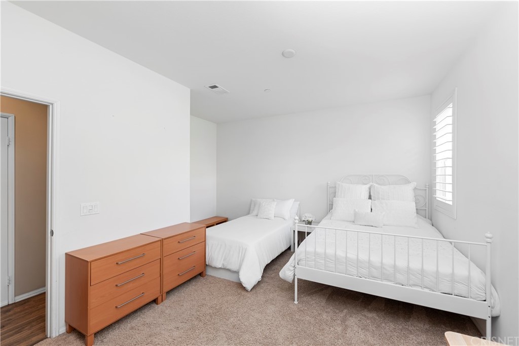 28504 Farrier Drive Valencia, CA 91354 - Photo 45 of 45 a bedroom with a bed and a dresser