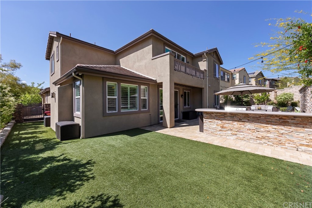 28504 Farrier Drive Valencia, CA 91354 - Photo 5 of 45 a front view of a house with a yard and garage