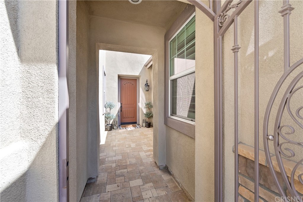 28504 Farrier Drive Valencia, CA 91354 - Photo 8 of 45 a view of a hallway with wooden floor and a living room