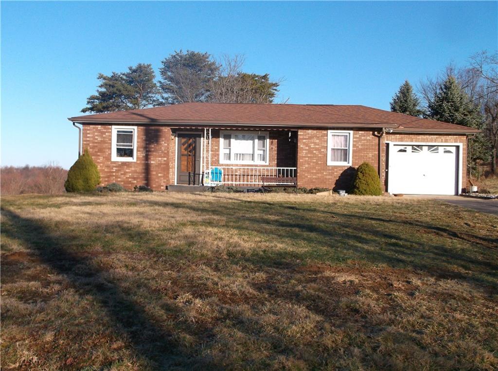Spacious ranch on more than a half acre in a pretty country setting.