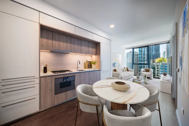 a kitchen with a table and chairs