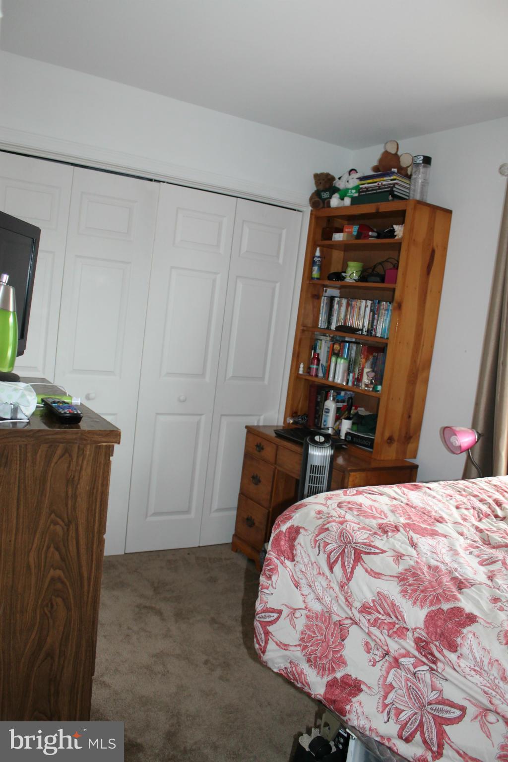 209 Robelei Drive Ranson, WV 25438 - Photo 12 of 30 a bedroom with a bed and a dresser