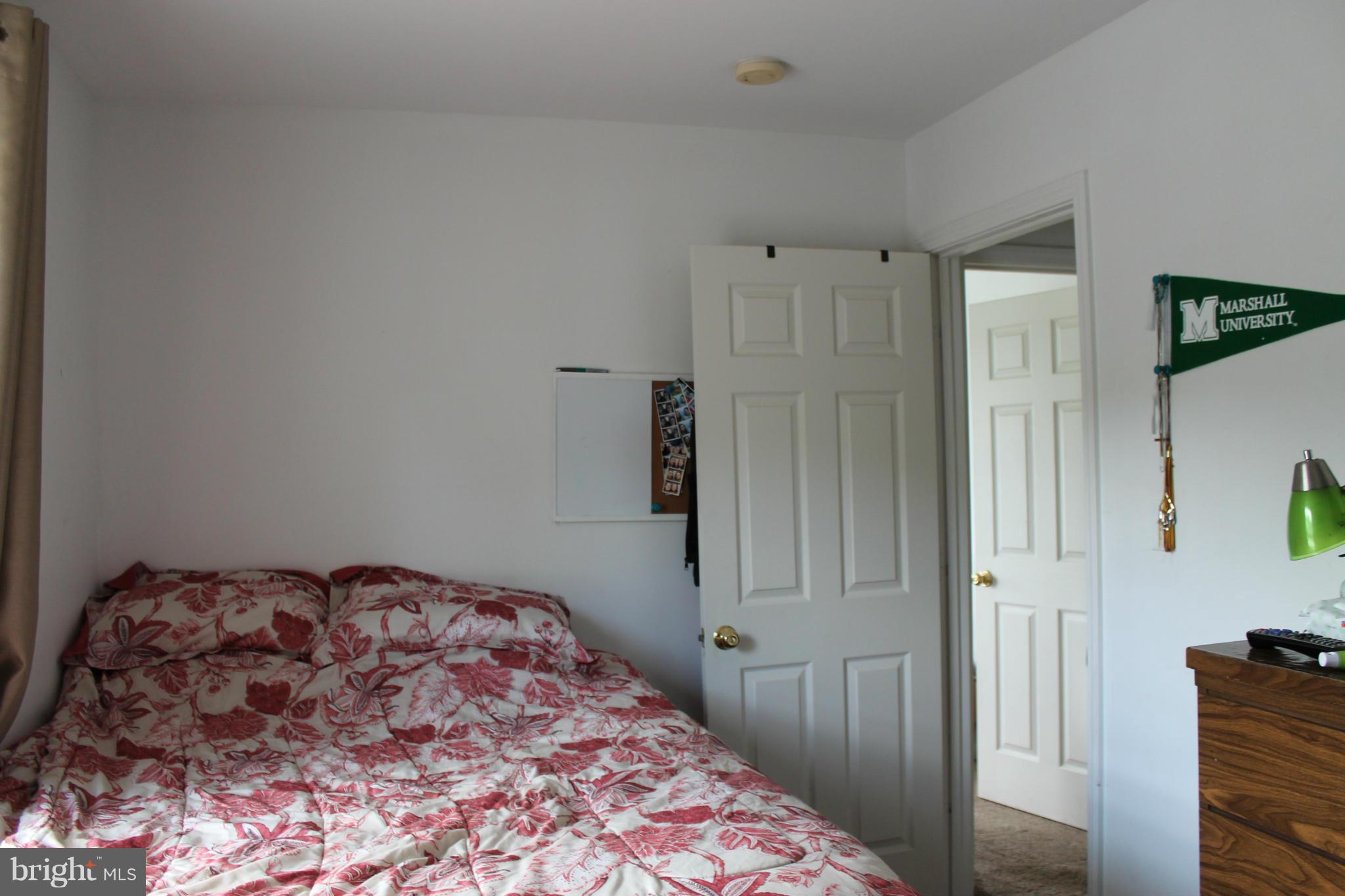 209 Robelei Drive Ranson, WV 25438 - Photo 13 of 30 a bedroom with a bed and a closet