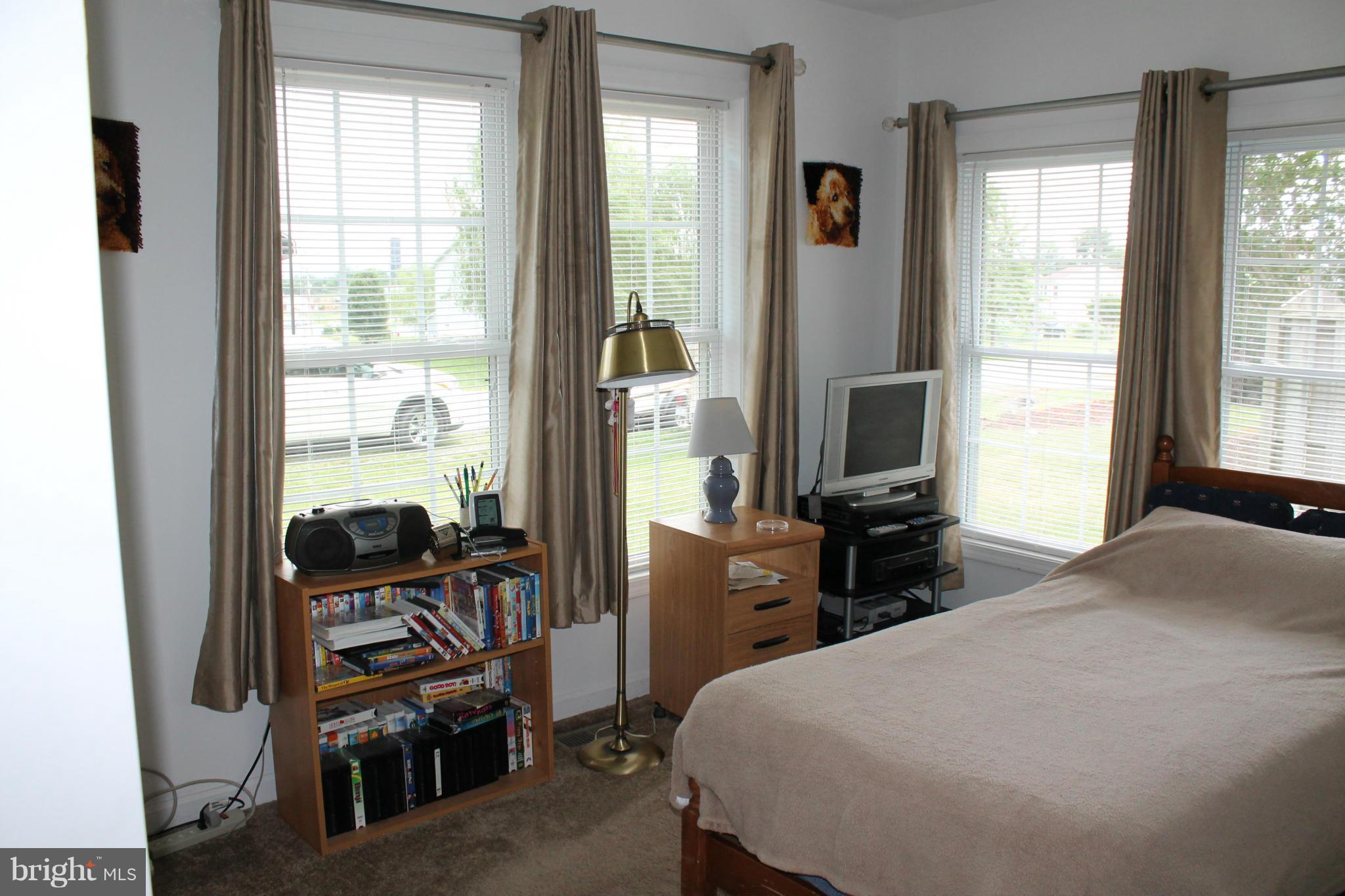 209 Robelei Drive Ranson, WV 25438 - Photo 14 of 30 a bedroom with a bed and a window