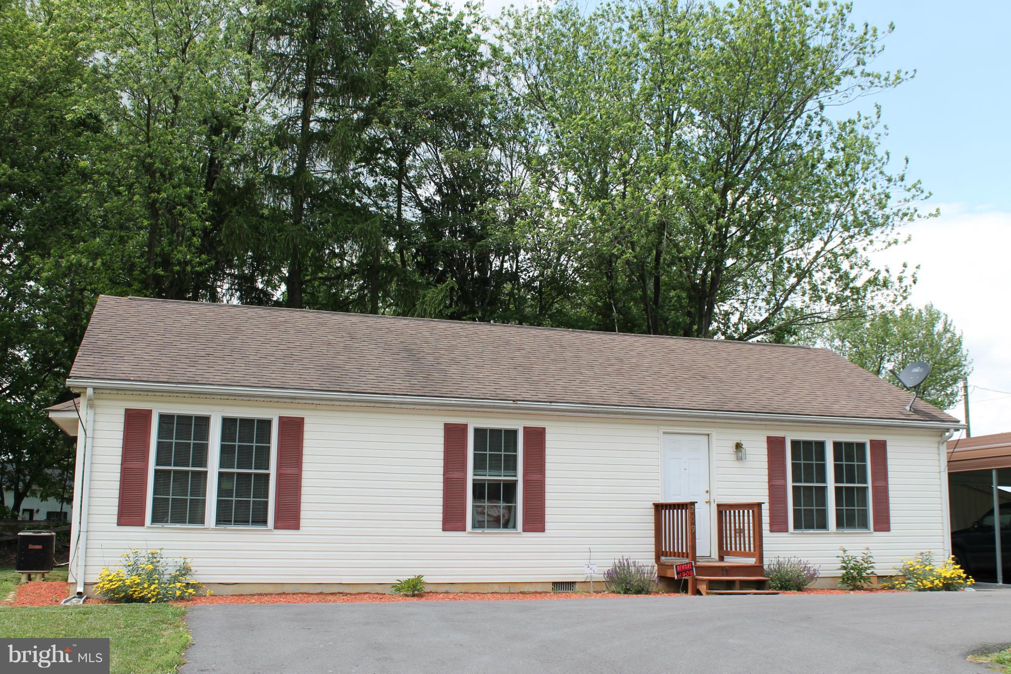 209 Robelei Drive Ranson, WV 25438 - Photo 26 of 30 a house view with a outdoor space