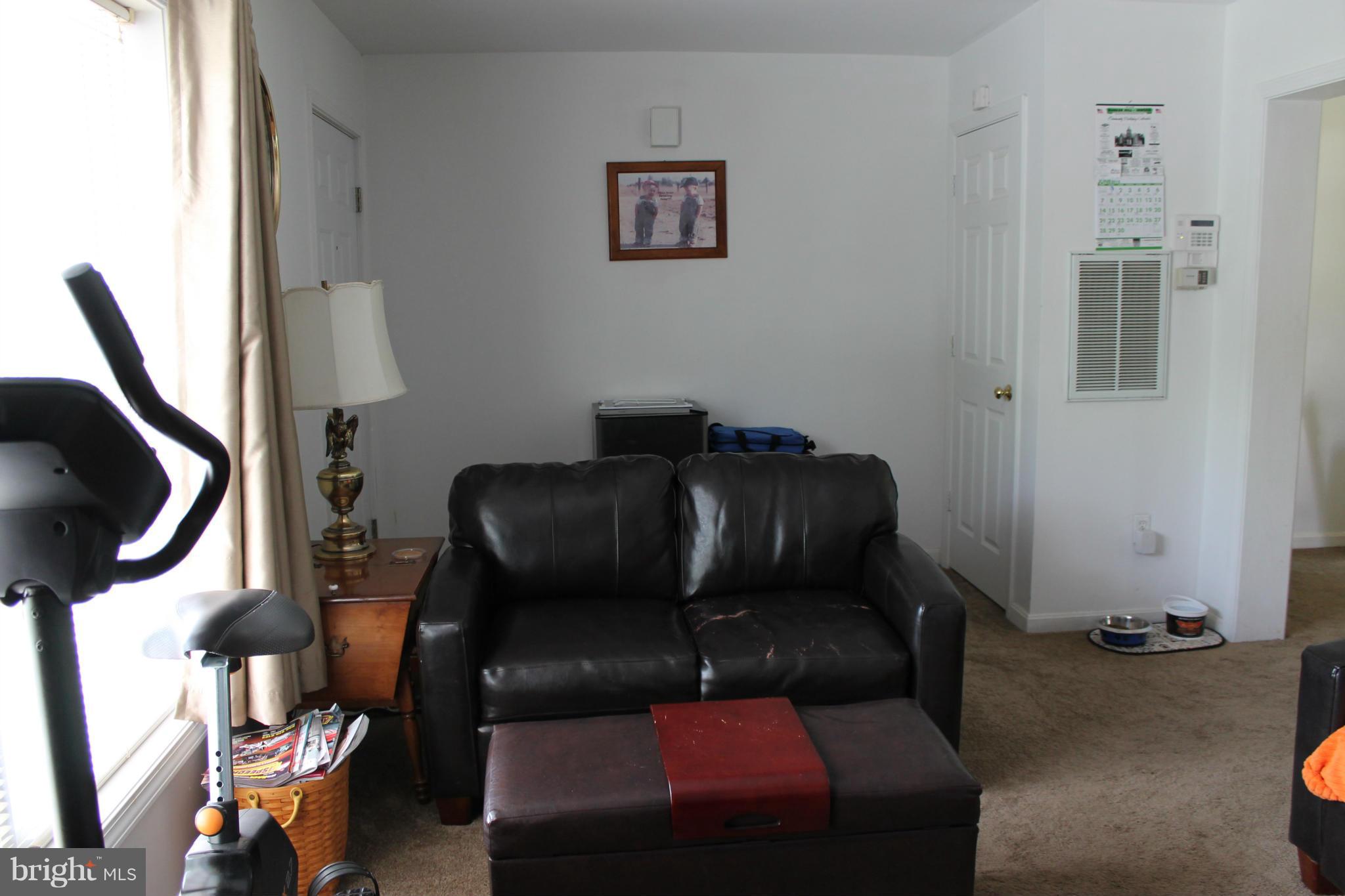 209 Robelei Drive Ranson, WV 25438 - Photo 5 of 30 a living room with furniture and a window