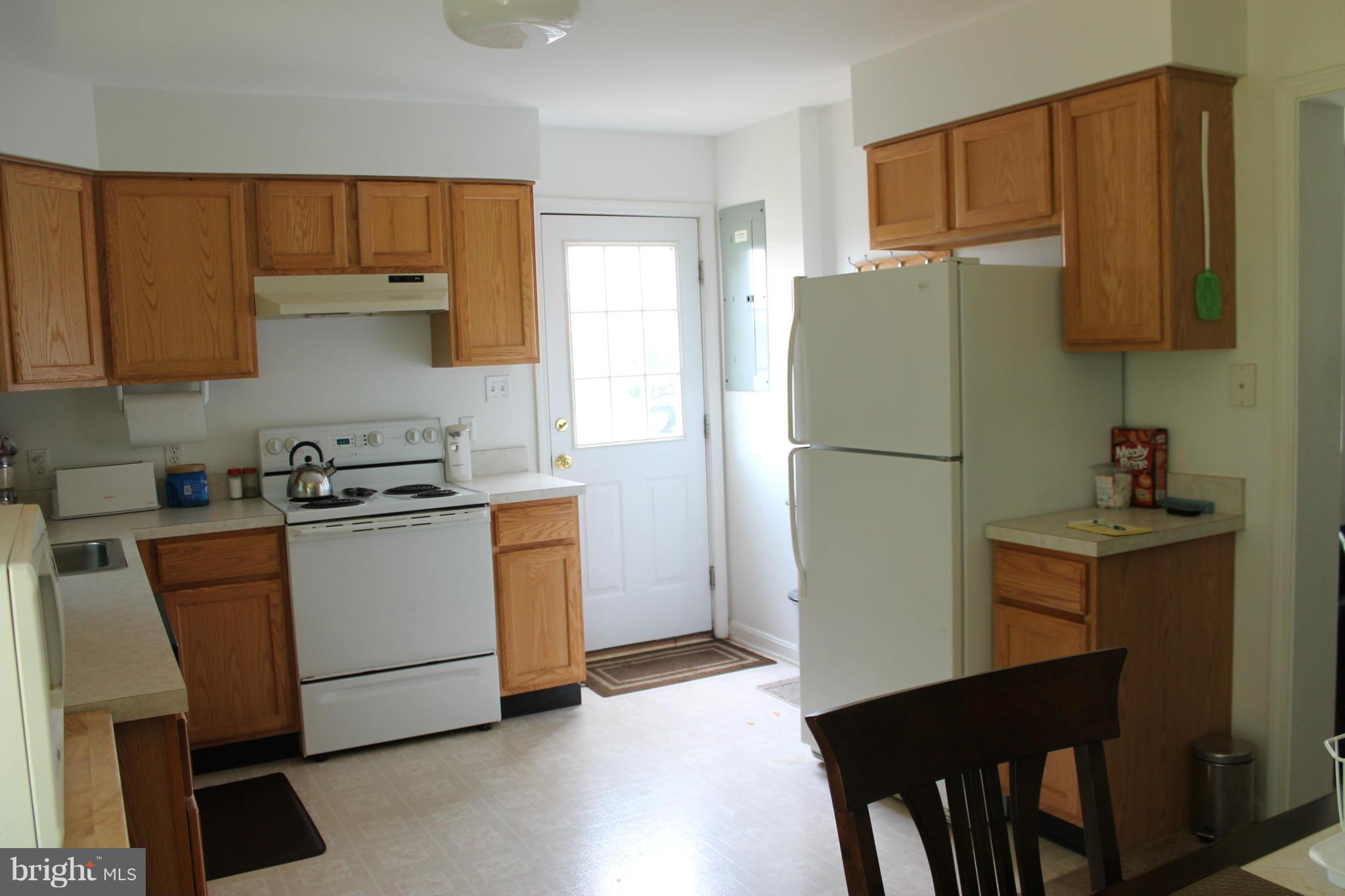 209 Robelei Drive Ranson, WV 25438 - Photo 8 of 30 a kitchen with a refrigerator and a sink