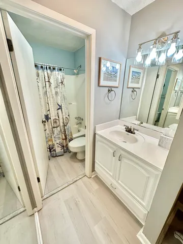 a bathroom with a double vanity sink and mirror