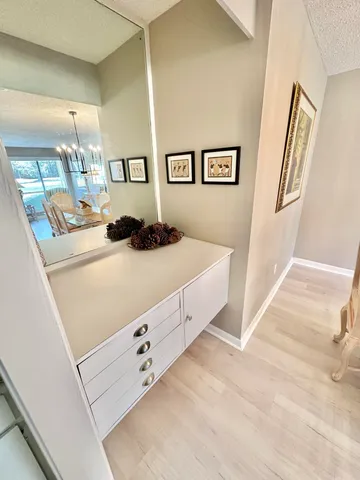 a bedroom with a bed and a large mirror on the wall