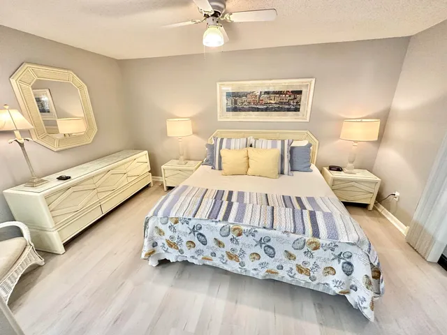 a bedroom with a bed and a couch