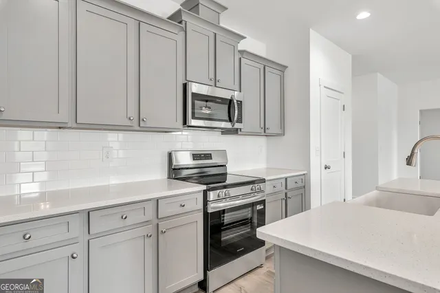 a view of a room with wooden floor and staircase