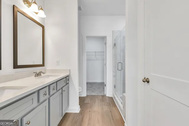 a bathroom with 2 sink and a mirror