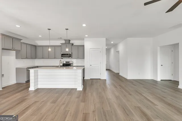 a view of kitchen with wooden floor