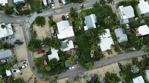 an aerial view of residential house with outdoor space