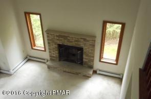 113 Wendell Road East Stroudsburg, PA 18301 - Photo 8 of 10 a view of an empty room with a window and fire place