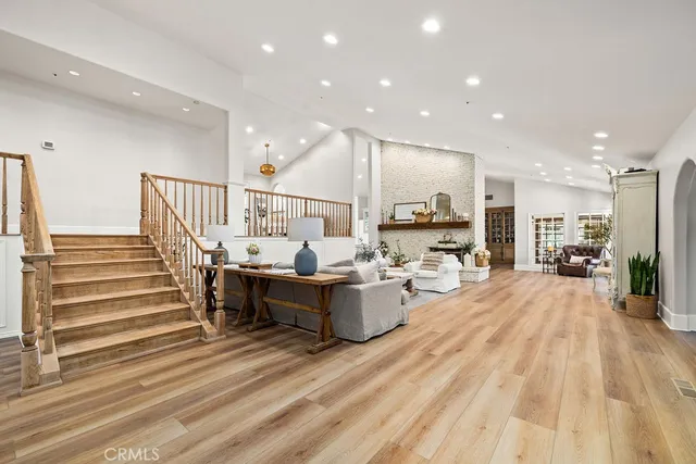 a bedroom with a large bed and a flat screen tv