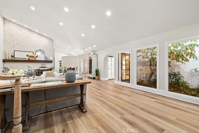 a spacious bedroom with a bed and a large window