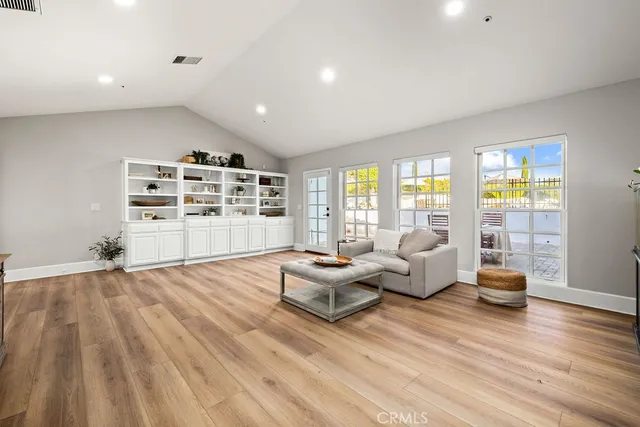 a view of a terrace with couches and city view