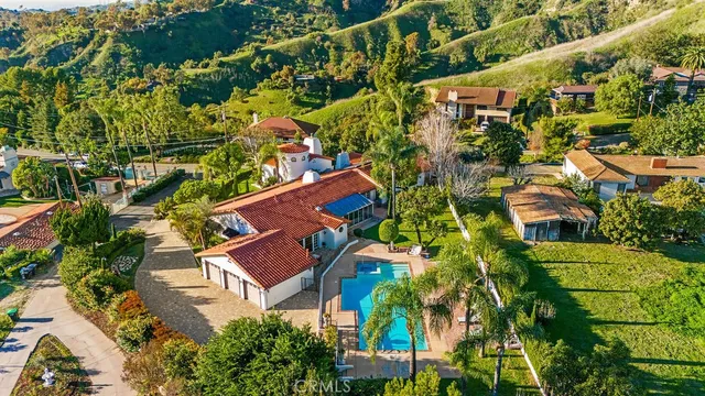 an aerial view of residential houses with outdoor space and river view