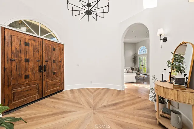 a living room with fireplace furniture and a wooden floor