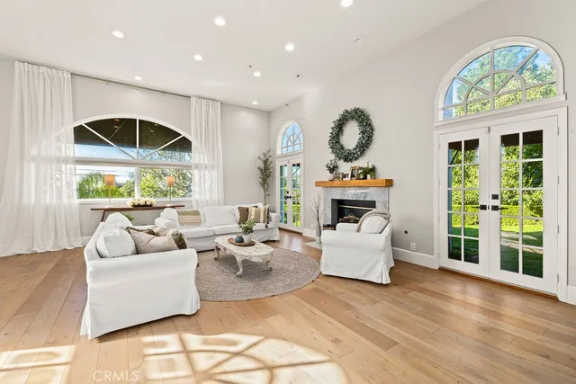 a living room with furniture a fireplace and a table