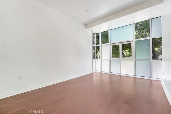 an empty room with wooden floor