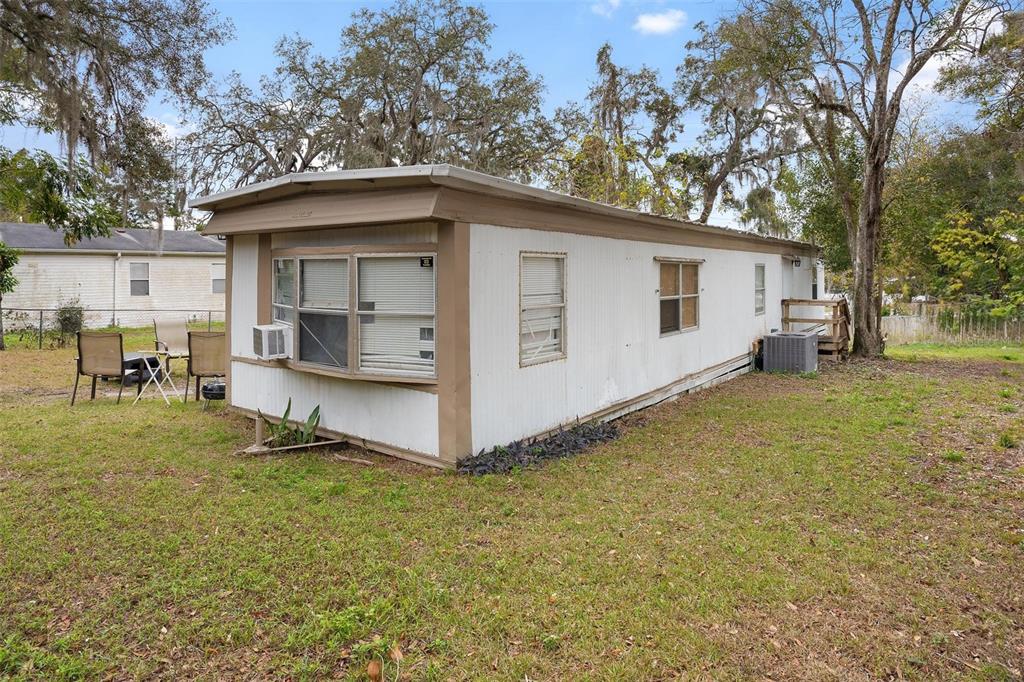 2107 Hialeah Avenue Leesburg, FL 34748 - Photo 4 of 10 a view of a backyard with small cabin