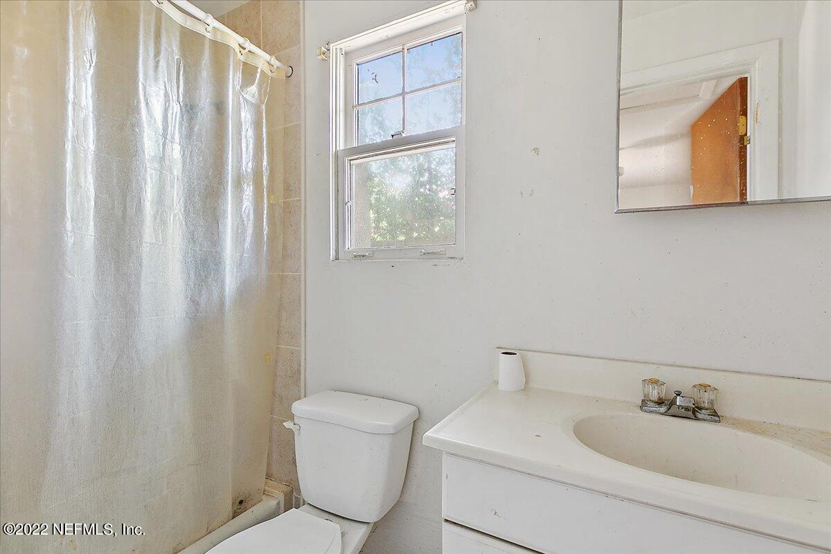 3404 St Augustine Road Jacksonville, FL 32207 - Photo 16 of 16 a bathroom with a sink and a mirror