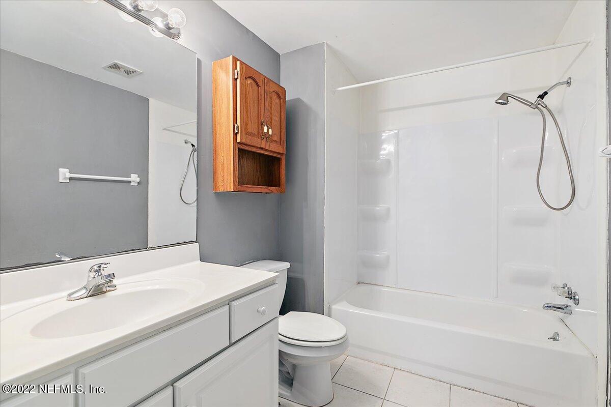 3404 St Augustine Road Jacksonville, FL 32207 - Photo 5 of 16 a bathroom with a sink toilet and shower