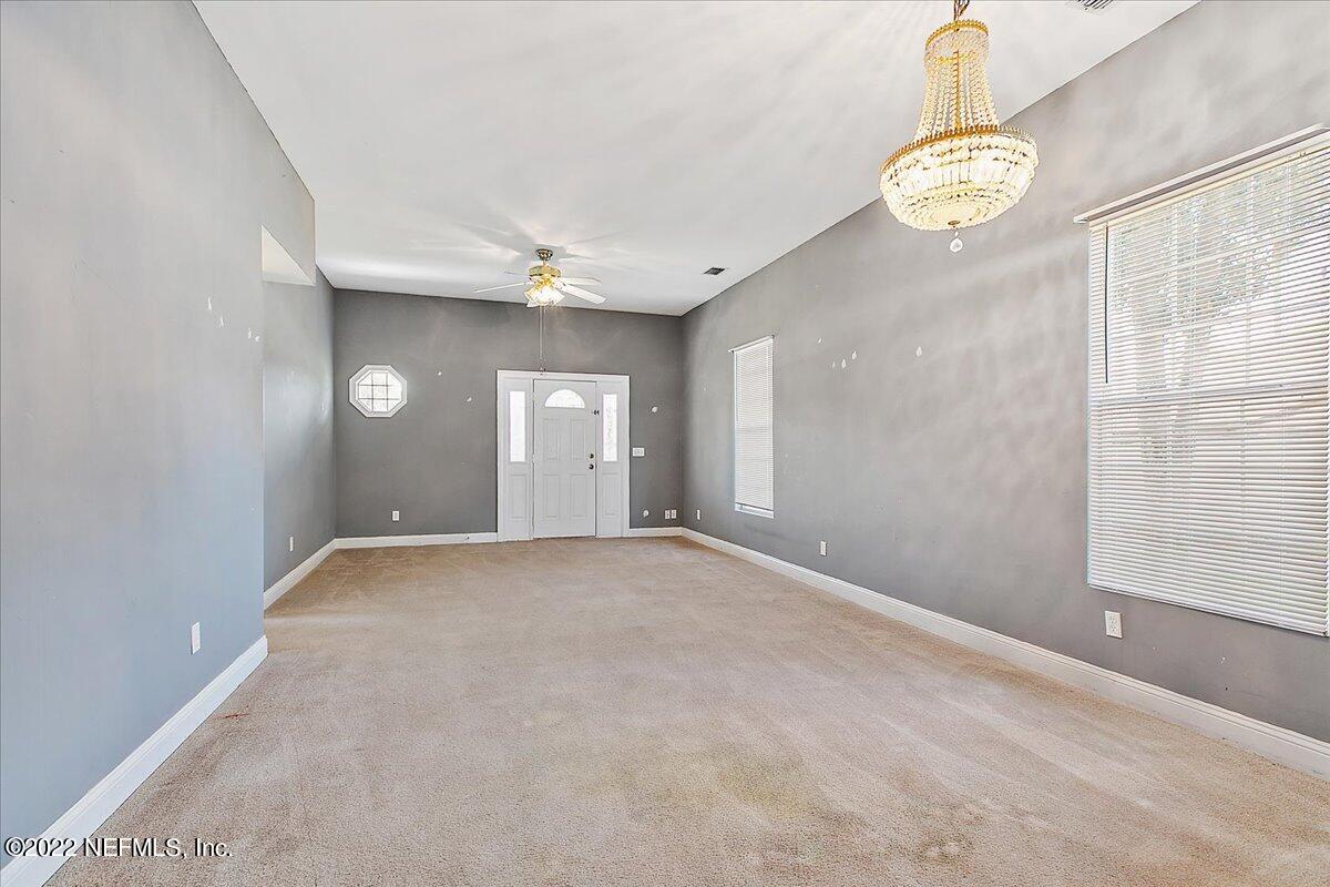 3404 St Augustine Road Jacksonville, FL 32207 - Photo 6 of 16 a view of an empty room with a window