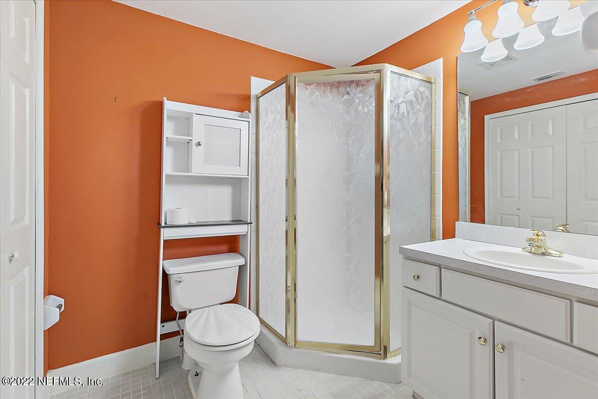 3404 St Augustine Road Jacksonville, FL 32207 - Photo 10 of 16 a bathroom with a toilet sink and shower