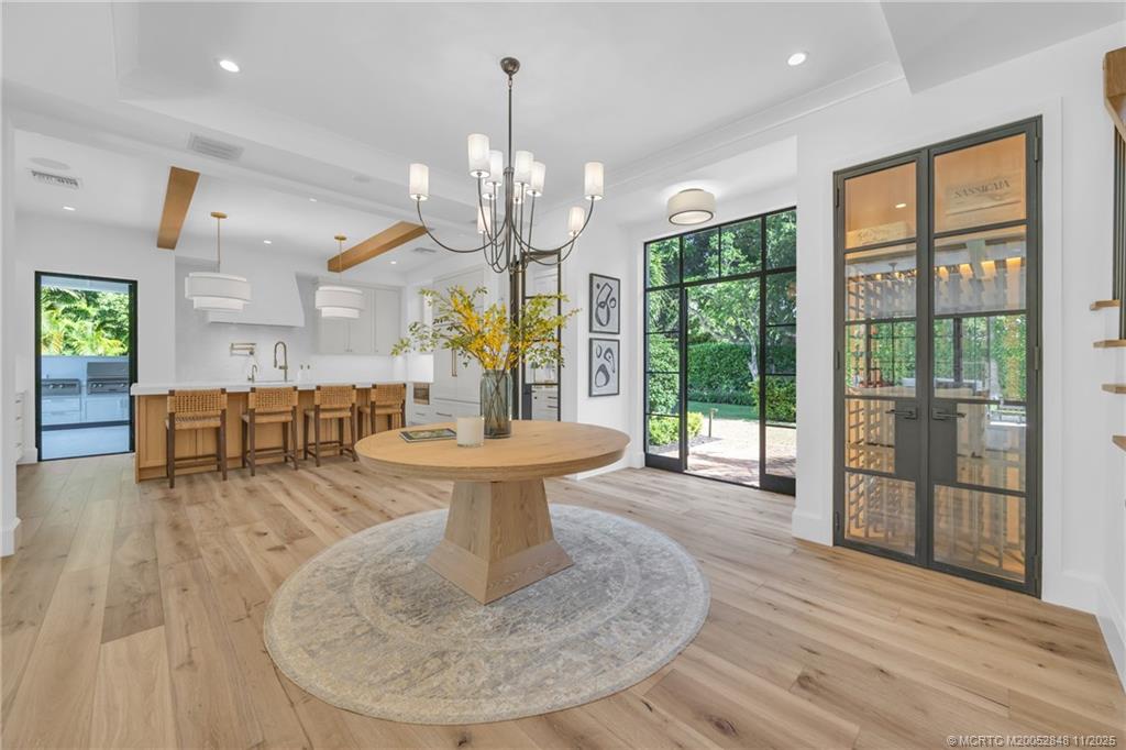 44 South Beach Road Hobe Sound, FL 33455 - Photo 27 of 73 a living room with fireplace furniture and a chandelier