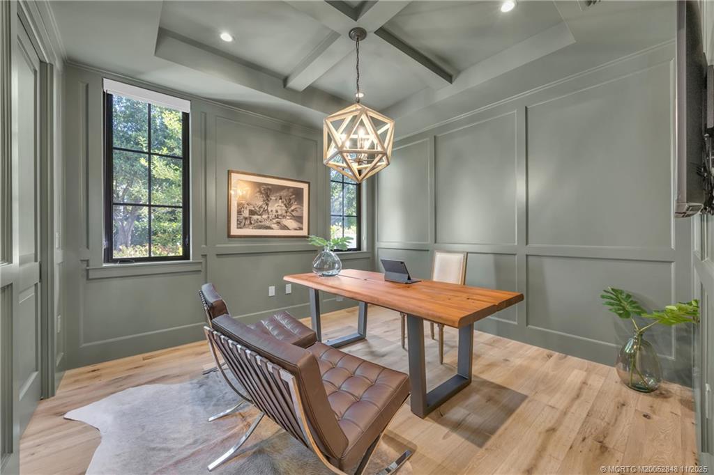 44 South Beach Road Hobe Sound, FL 33455 - Photo 29 of 73 a room with chandelier fan and wooden floor