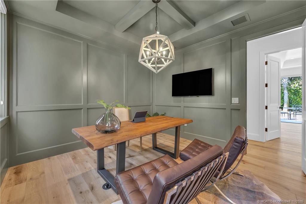 44 South Beach Road Hobe Sound, FL 33455 - Photo 30 of 73 a workspace with furniture and wooden floor