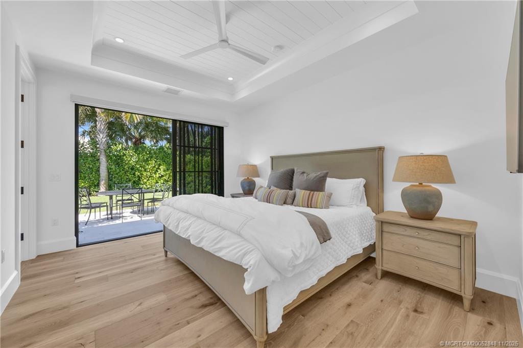 44 South Beach Road Hobe Sound, FL 33455 - Photo 32 of 73 a large bedroom with a bed and large windows