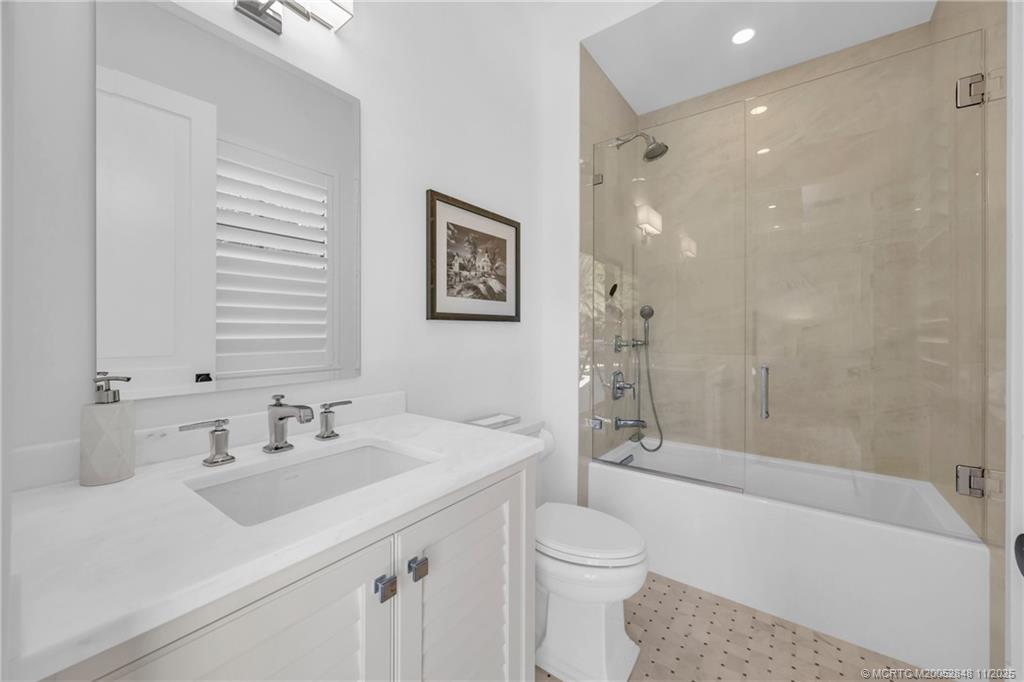 44 South Beach Road Hobe Sound, FL 33455 - Photo 34 of 73 a bathroom with a sink a toilet and shower
