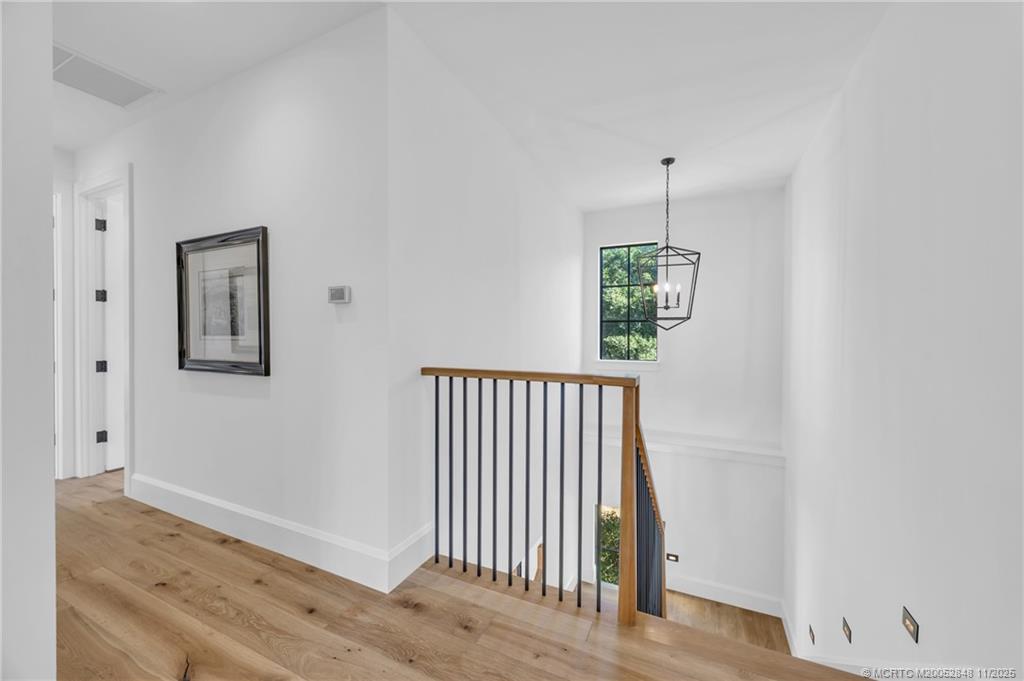 44 South Beach Road Hobe Sound, FL 33455 - Photo 37 of 73 an entryway to room with wooden floor and windows