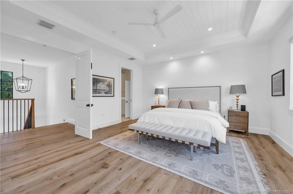 44 South Beach Road Hobe Sound, FL 33455 - Photo 39 of 73 a spacious bedroom with a bed and a view of bathroom