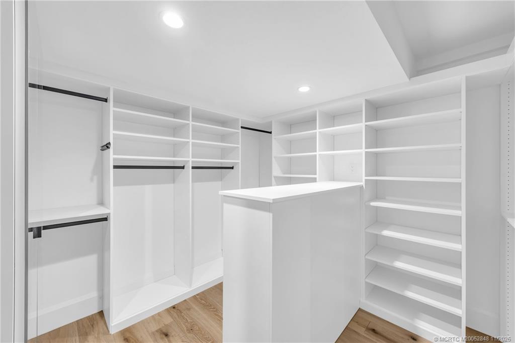 44 South Beach Road Hobe Sound, FL 33455 - Photo 44 of 73 a view of walk in closet with empty racks