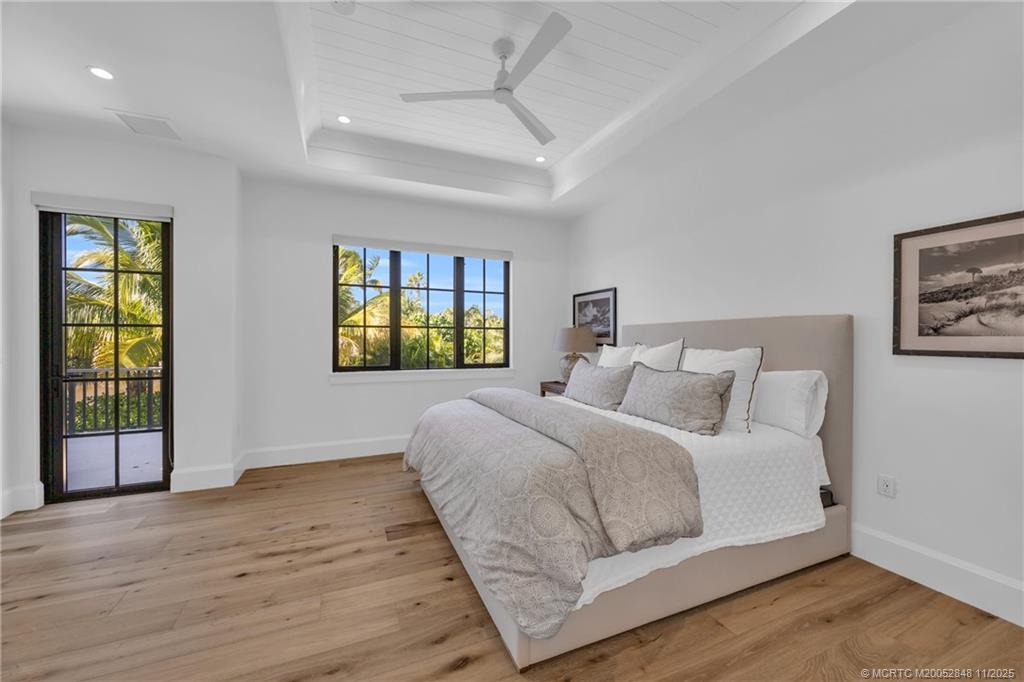 44 South Beach Road Hobe Sound, FL 33455 - Photo 49 of 73 a bedroom with a bed and a window