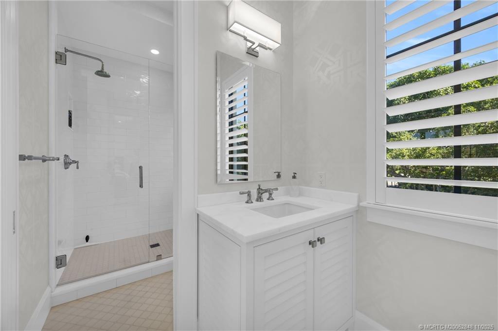 44 South Beach Road Hobe Sound, FL 33455 - Photo 50 of 73 a bathroom with a sink a toilet and shower