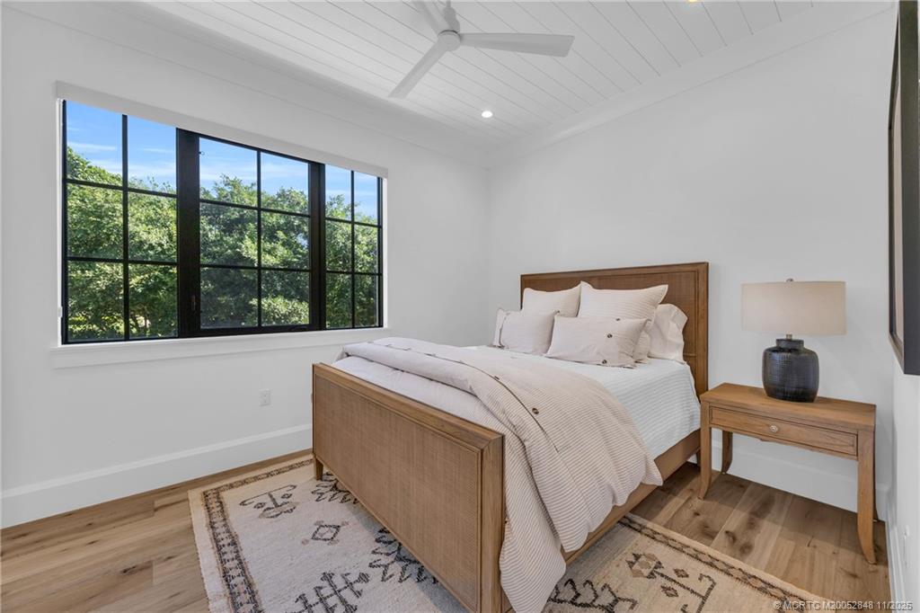 44 South Beach Road Hobe Sound, FL 33455 - Photo 54 of 73 a bedroom with a bed and a window