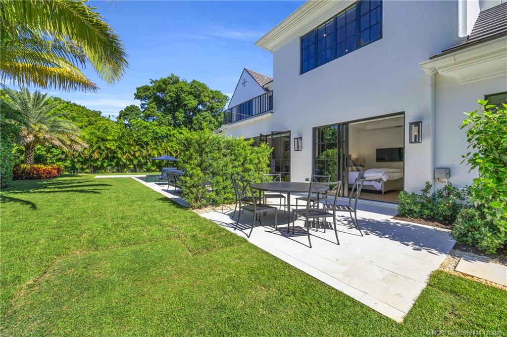 44 South Beach Road Hobe Sound, FL 33455 - Photo 56 of 73 a view of a patio with chairs and plants