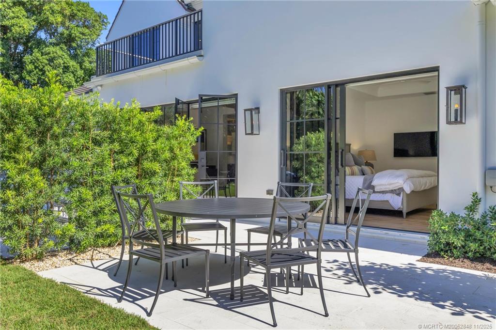 44 South Beach Road Hobe Sound, FL 33455 - Photo 57 of 73 a building outdoor space with patio furniture and potted plants