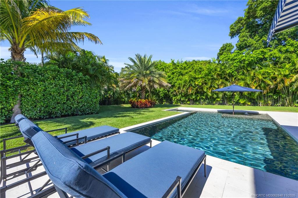 44 South Beach Road Hobe Sound, FL 33455 - Photo 62 of 73 a view of yard with seating area